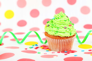 Birthday cupcake with butter cream and candle 