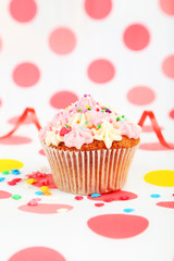 Birthday cupcake with butter cream and candle 