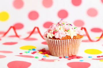 Birthday cupcake with butter cream and candle 