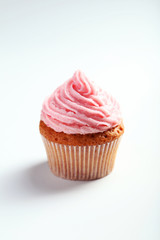 Birthday cupcake with butter cream on white background