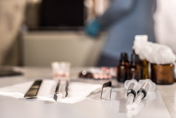 Syringe with glass vials and medications pills drug