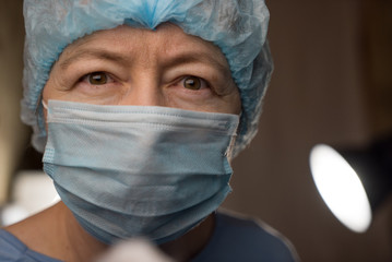 female dentist with tools