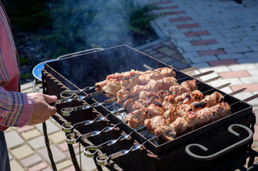 Preparation of shish kebabs outdoors