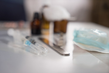 Syringe with glass vials and medications pills drug