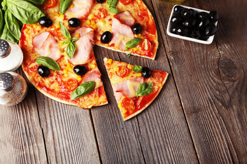 Delicious fresh pizza on brown wooden background