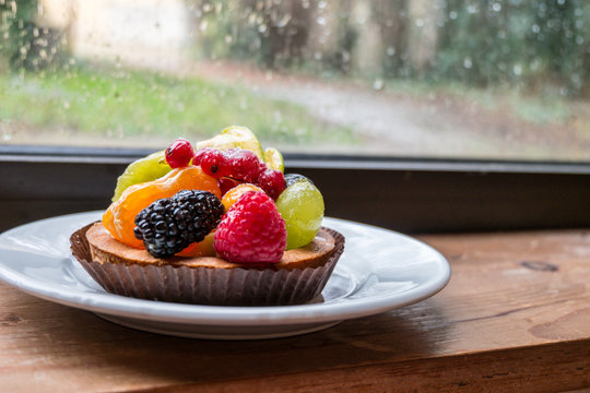 fresh fruit pie tart with kiwi, blueberry, orange and strawberry