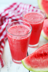 Watermelon smoothies on white wooden background