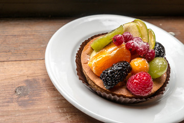fresh fruit pie tart with kiwi, blueberry, orange and strawberry