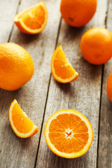 Obraz na płótnie Canvas Fresh orange fruit on grey wooden background