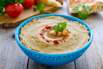 Homemade hummus from chickpea in blue bowl