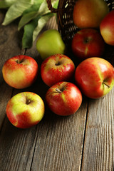Beautiful apples on brown wooden background