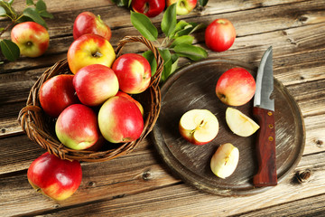 Beautiful apples on brown wooden background