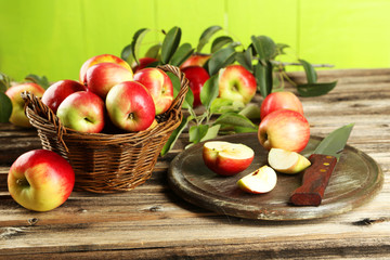 Beautiful apples on brown wooden background