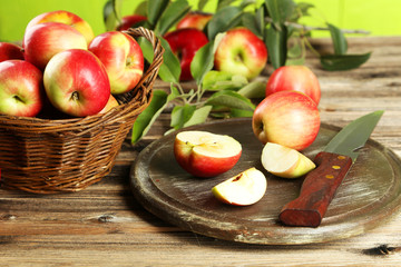 Beautiful apples on brown wooden background