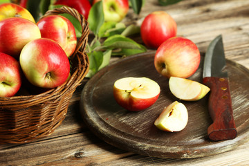 Naklejka na ściany i meble Beautiful apples on brown wooden background