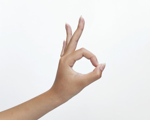 OK hand sign on white background