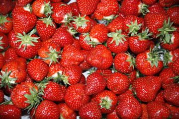 Freshly picked strawbewrries on market stall