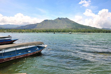 boats in Lake Batur with volcano Batur. Indonesia, Bali