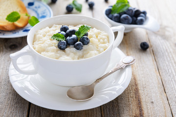 Rice pudding with blueberry decorated with mint leaf