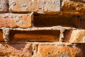 Brown brick wall background texture.