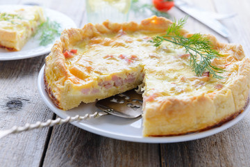 Quiche lorraine on white plate