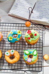 Decorating delicious donuts in the rustic kitchen