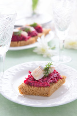 Canape with beetroot  and herring
