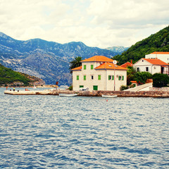 Fototapeta na wymiar Old fishing village with pier , Kotor Bay, Montenegro.