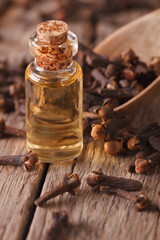 clove oil in a bottle of glass macro vertical
