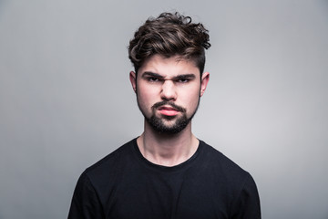 Obraz premium Portrait of young man in black T-shirt
