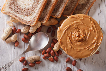 Peanut butter and bread close-up. horizontal top view

