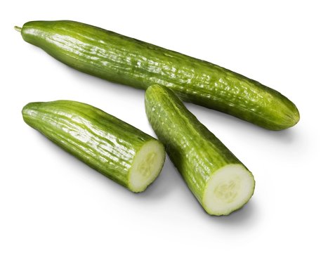 Cucumber and slices on a white background