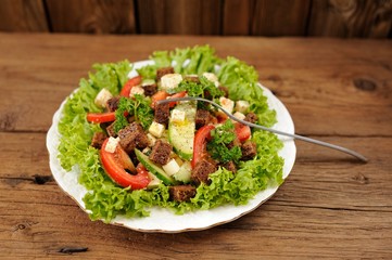 Vegetable salad made of lettuce, cucumbers, tomatoes, cheese and
