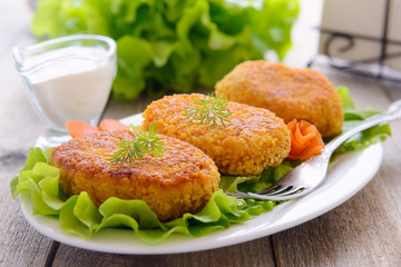 Dietetic carrots cutlets with white sauce