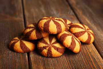 Delicious cookies on brown wooden background
