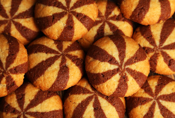 Delicious cookies on brown wooden background