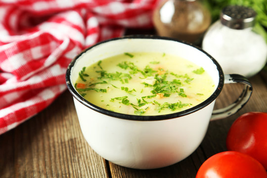 Cup Of Soup On Brown Wooden Background