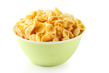 Bowl of cornflakes isolated on white