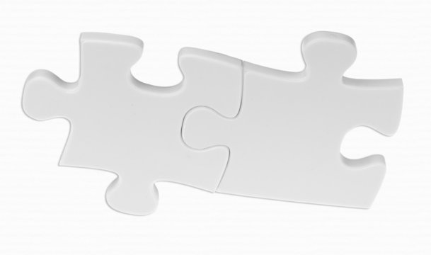 deux pièces blanches de puzzle sur fond papier blanc 