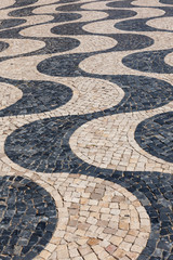 Typical portuguese cobblestone hand-made pavement cal&ccedil;ada in Li