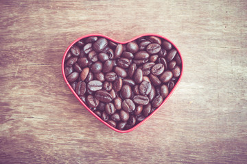 Fototapeta premium Heart shaped coffee beans with filter effect retro vintage style