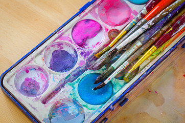 Fototapeta premium palette with watercolor ink and brush