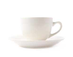 White ceramic cup on a plate isolated