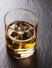 Glass of scotch whiskey with ice