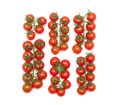 ripe cherry tomatoes isolated on a white background