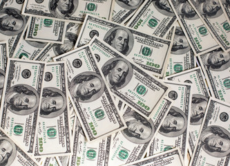 A pile of one hundred dollar bills