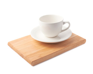 Empty cup on a wooden board isolated