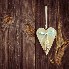 wooden heart hanging on a branch