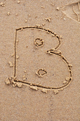 letter B on the sand