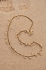 letter C on the sand